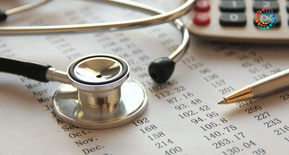 Stethoscope, pen, and calculator on top of ledger